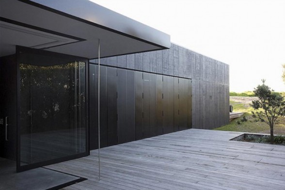 Black Cubic House Design with Mixing Modern Architecture and Natural Environment - Yard