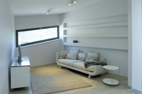Eco Friendly House in Bunker Style Home Architecture - TV Room