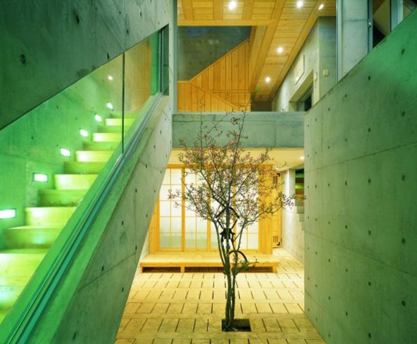 Great Combination of Wood and Concrete in a Courtyard House Design - Staircase with Lamp Decoration