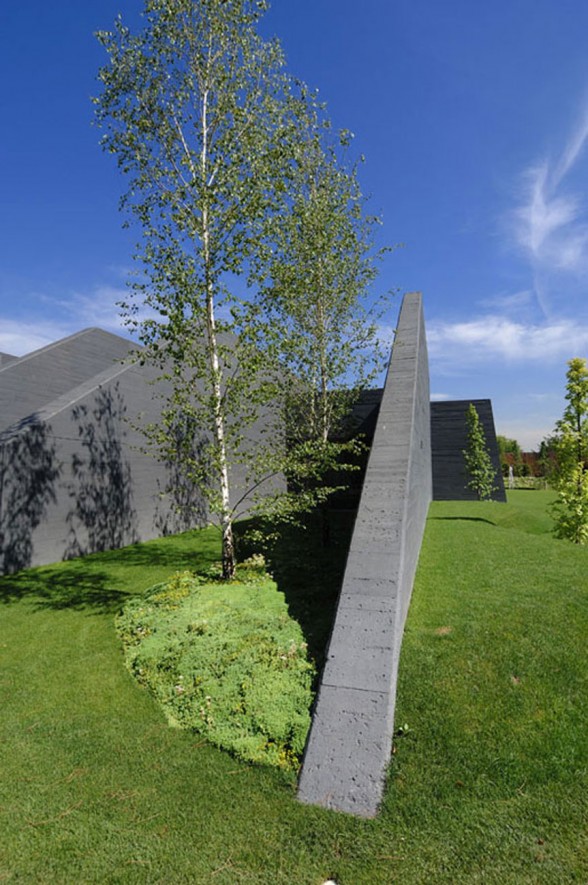 Huge Concrete House Design with Black Interior and Exterior - Garden