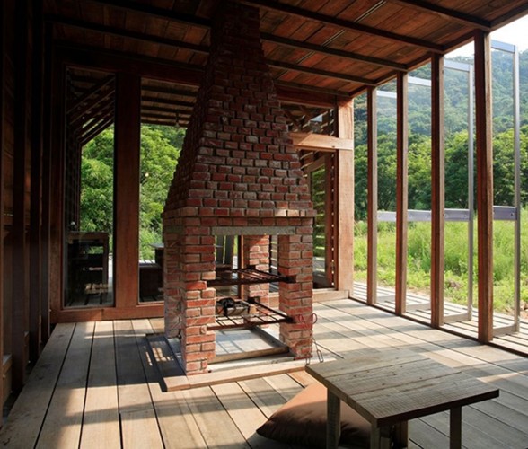 Timber House with Mahogany Materials from Marco Casagrande - Fireplace