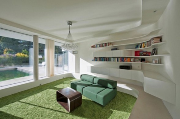 Curved House Design with Modern Architecture from Caramel Architect - Green Livingroom