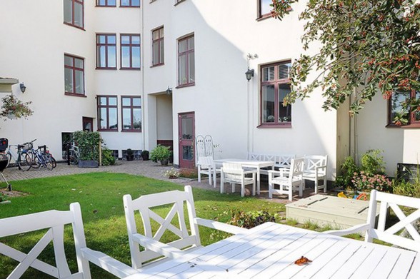 Elegant White Interior Design of a Minimalist Duplex Apartment Plans - Garden
