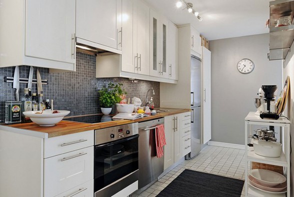 Elegant White Interior Design of a Minimalist Duplex Apartment Plans - Kitchen