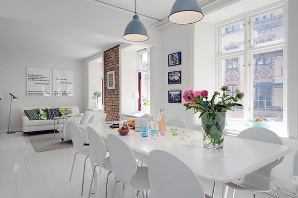 Elegant White Interior Design of a Minimalist Duplex Apartment Plans - Long Dining Table