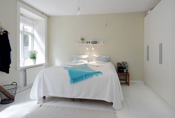 Elegant White Interior Design of a Minimalist Duplex Apartment Plans - Master Bedroom