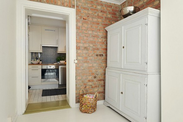 Elegant White Interior Design of a Minimalist Duplex Apartment Plans - Storage