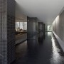Contemporary Concrete Building Architectural Designs with Revolutionary Furnishing Space: Dark Indoor Swimming Pool