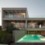 Modern Concrete House Softened By The Walnut Notes in Lisbon: View Swimming Pool Of Modern House