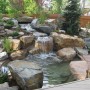 Backyard Water Features Design: Beautiful Landscape Stone Garden Backyard Water Features With Wooden Fence