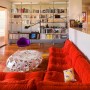 Togo Sofa as Your Choice to Have a Comfort Life: Magnificent Red Togo Sofa Modern Spacious Room With Bookshelf