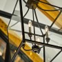 2014 Family Area Trends Preparing Up To Date Living: Classic Style Chandelier In Black Combined With Exposed Steel Collar Connecting Beams On Ceiling For Captivating Interior Decoration