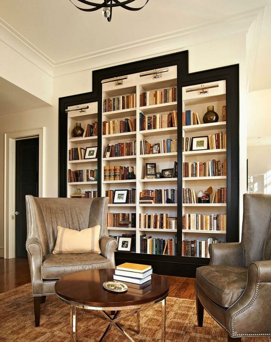 White Wood Living Room Featured with Floor to Ceiling White Bookcase with Black Trims Giving Surprising Decoration