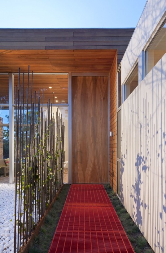 Creative Entrance Way with Red Path Combined with Natural Decorations and Fencing Introducing Stylish Wood Entrance Door