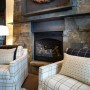 2014 Family Area Trends Preparing Up To Date Living: Armchairs With Classic Patterns Combined With Traditional Fireplace With Stone Surrounding And Decorative Accessories Above It