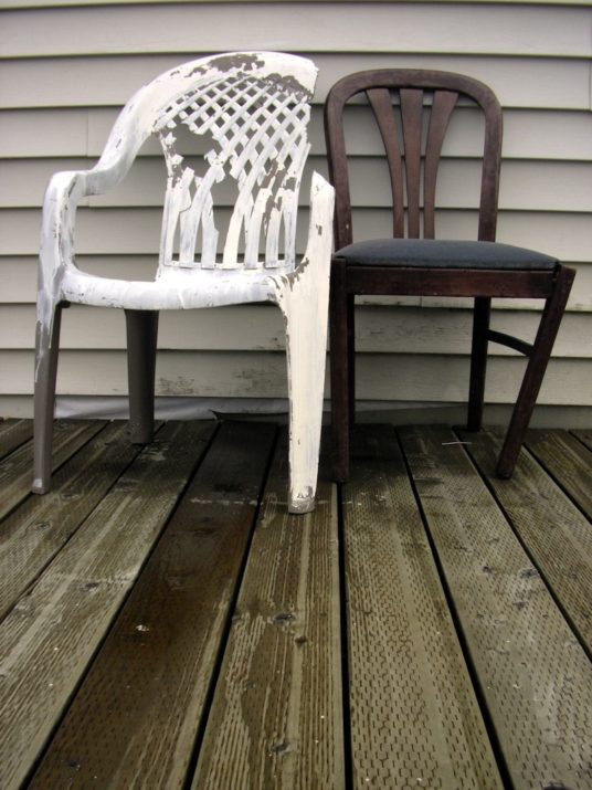 Two broken chairs on a porch